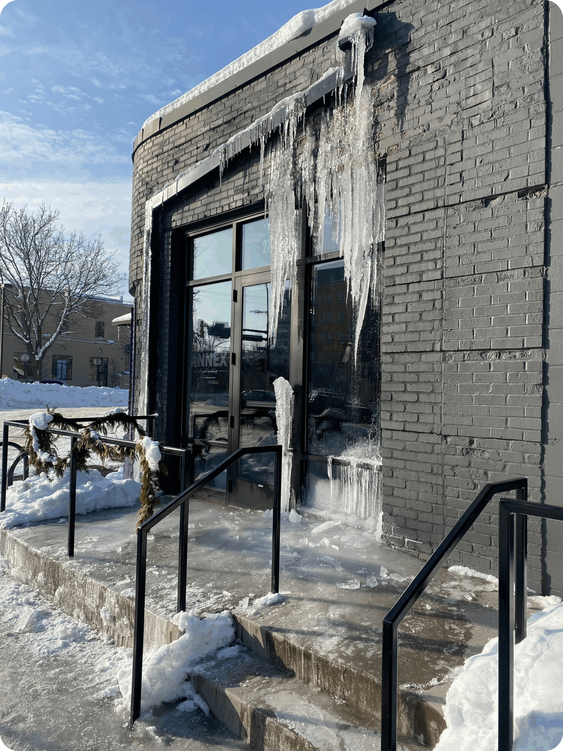 Ice damage near door and foundation